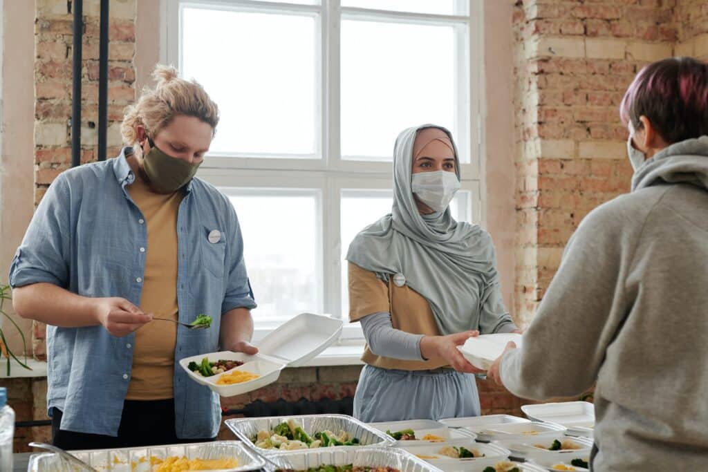 volunteers giving out meals