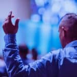 man standing up in church