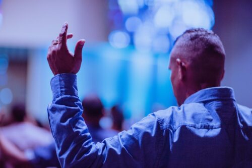 man standing up in church